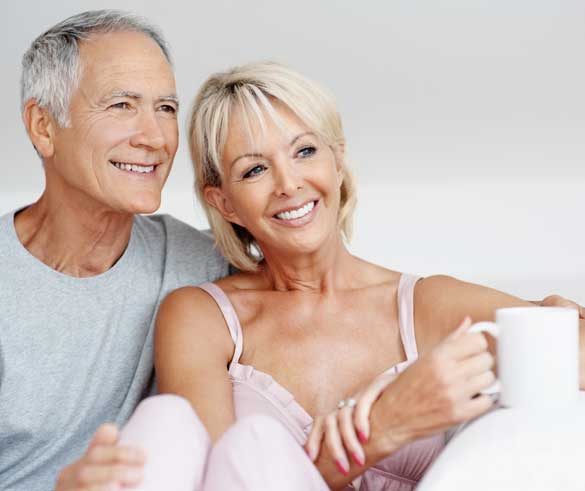 Couple Smiling with Dental implants