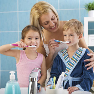 Pediatric Brushing Mother brushing kids teeth